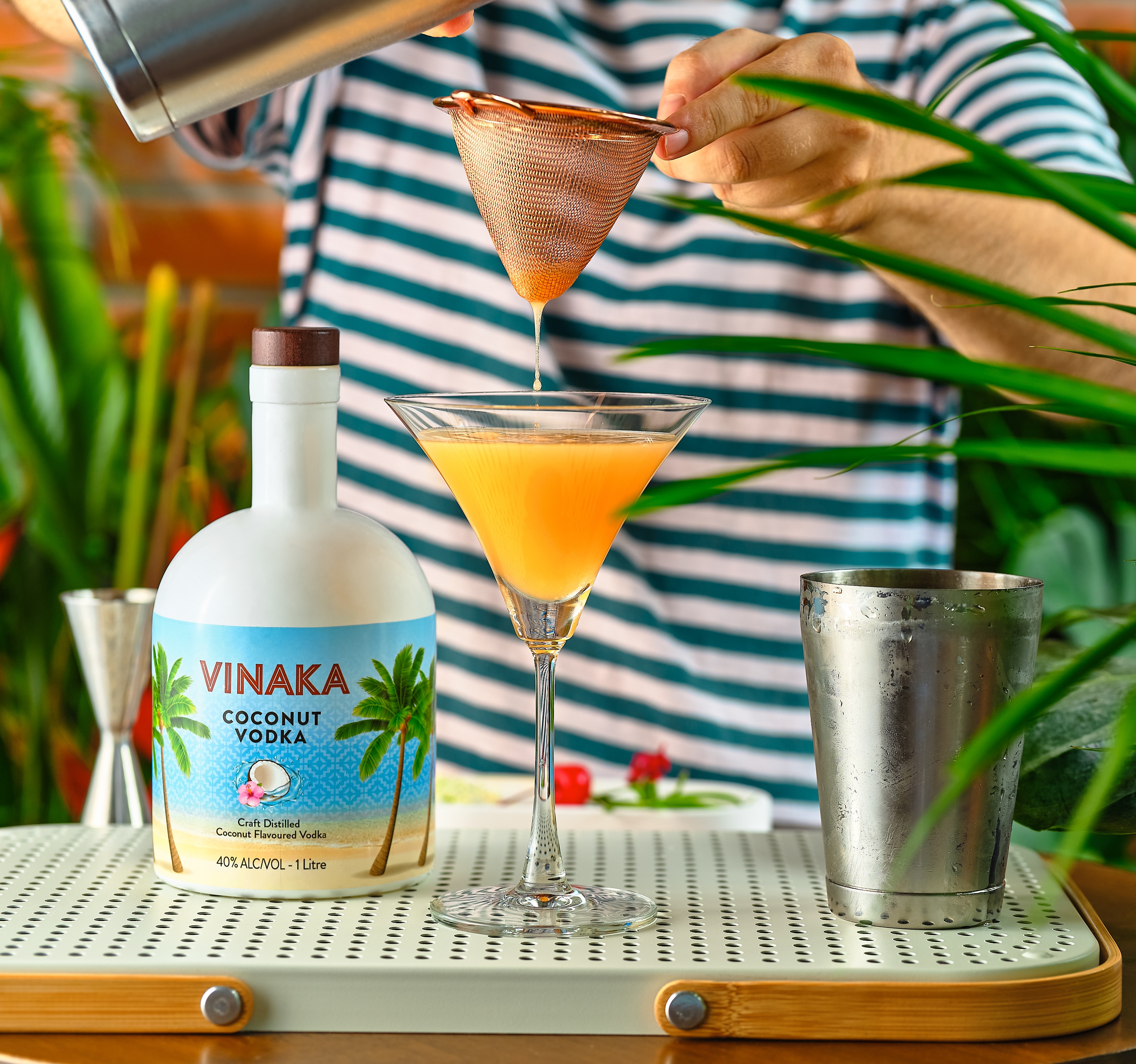 Vinaka Vodka Bottle and Orange Cocktail